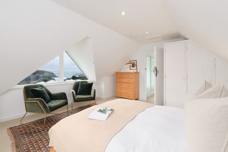 Sea-view bedroom with neutral interiors