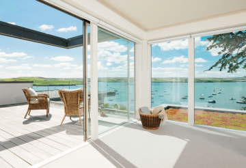Sea-view master bedroom with white interiors