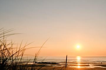 Deep orange sunset over Gwithian Beach.