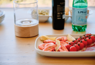 Close-up of seafood and vine tomatoes
