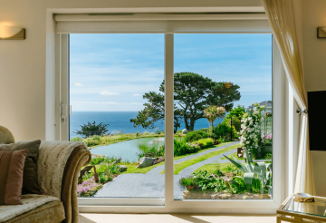 A sea-view home overlooking a large garden and pond